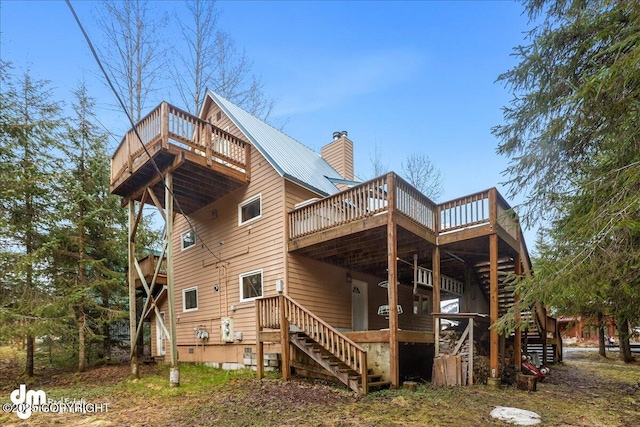 337 Alta Dr, Girdwood, AK 99587 - back of house featuring stairs, a chimney, and a deck