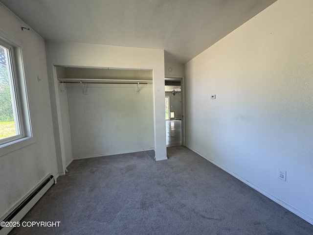 3140 N Brocton Ave, Wasilla, AK 99654 - unfurnished bedroom with carpet floors, multiple windows, baseboard heating, and a closet