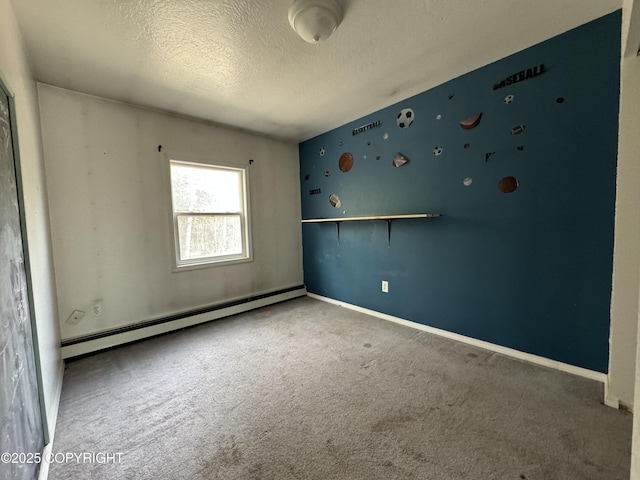 3140 N Brocton Ave, Wasilla, AK 99654 - carpeted spare room with a textured ceiling, baseboards, and baseboard heating