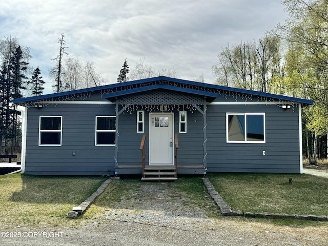 3140 N Brocton Ave, Wasilla, AK 99654 - view of front of home with entry steps and a front lawn
