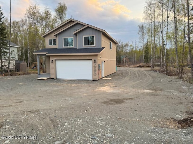 view of home's exterior featuring a garage and driveway
