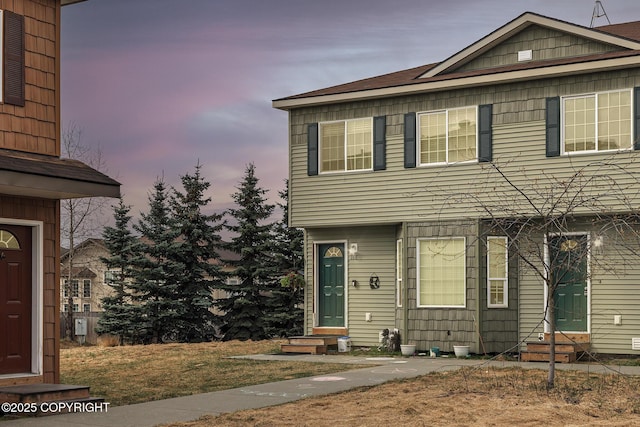 view of front of home featuring a yard and entry steps
