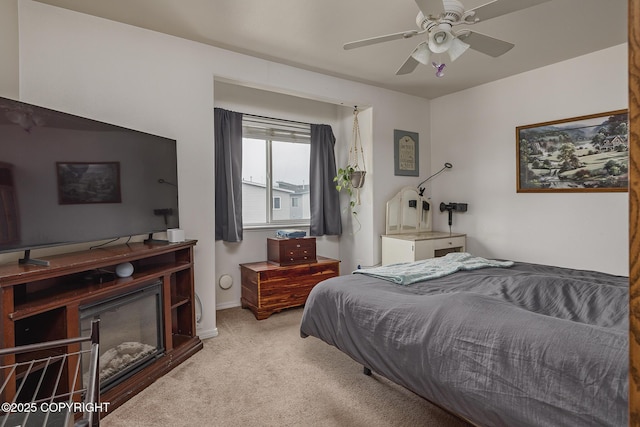 carpeted bedroom with a ceiling fan
