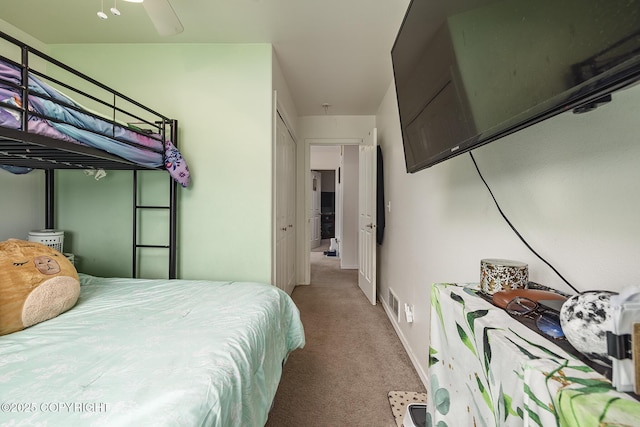 carpeted bedroom with baseboards