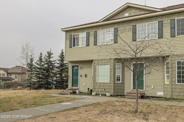 view of front of house with a front lawn and entry steps