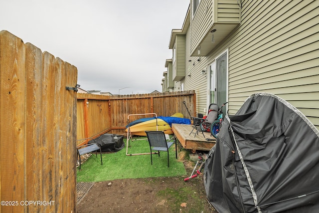 view of patio featuring fence and area for grilling