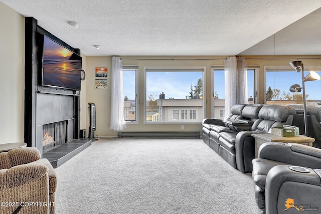 living room featuring carpet floors, a baseboard radiator, a textured ceiling, and a fireplace