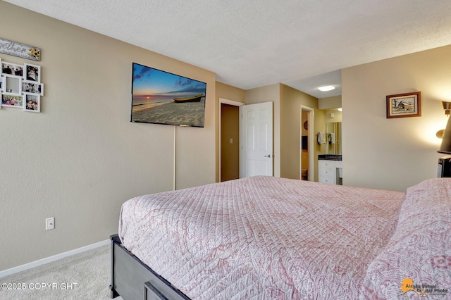 bedroom featuring baseboards, carpet, and a textured ceiling