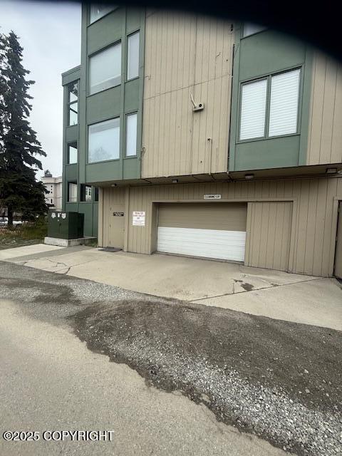 exterior space featuring a garage and driveway
