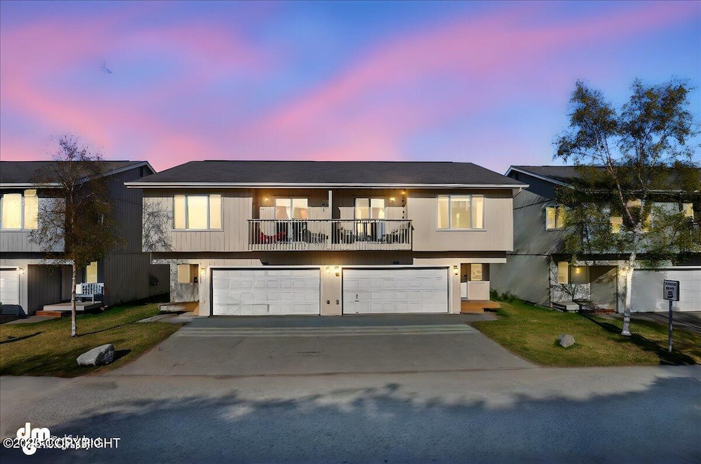 5214 Sleepy Meadow Pl # 43, Anchorage, AK 99507 - view of front facade featuring driveway, an attached garage, and a front lawn
