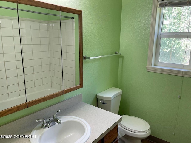 5875 E Alder Cir, Wasilla, AK 99654 - bathroom with vanity, a textured wall, toilet, and a shower