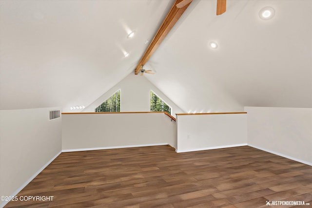 additional living space featuring baseboards, ceiling fan, visible vents, wood finished floors, and vaulted ceiling with beams
