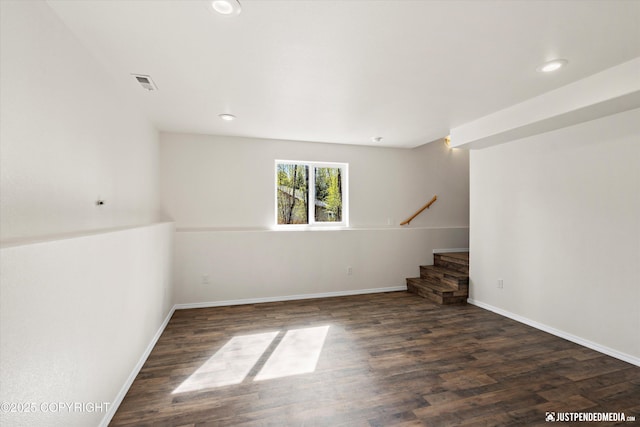 basement featuring visible vents, wood finished floors, stairway, and recessed lighting