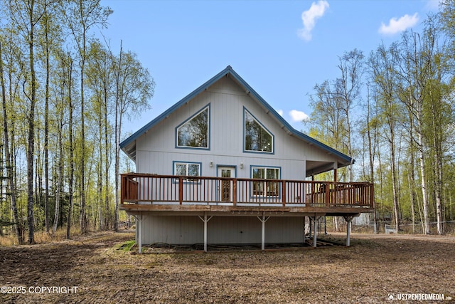 back of property featuring a wooden deck