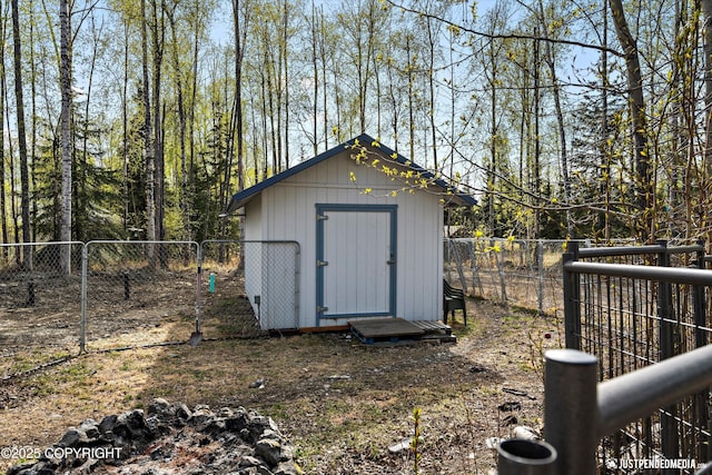 view of shed featuring a fenced backyard