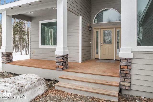 doorway to property with covered porch