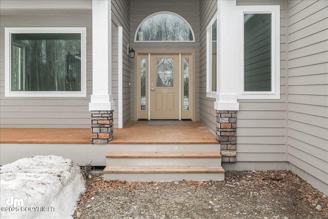 property entrance with stone siding