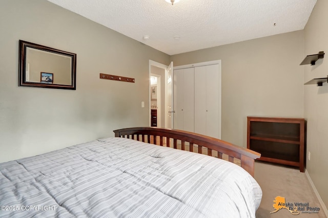 bedroom featuring a closet, carpet, and baseboards