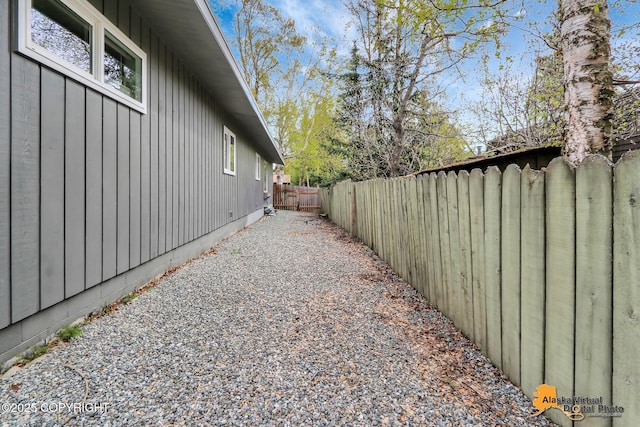 view of home's exterior featuring board and batten siding and a fenced backyard