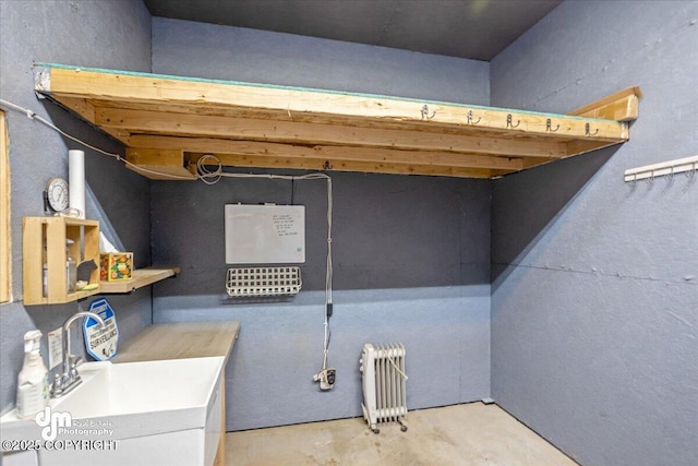 interior space featuring radiator and a sink