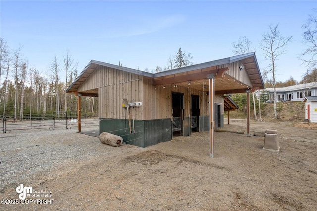 view of side of property featuring an exterior structure and an outbuilding