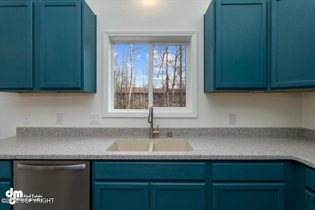 kitchen with light countertops, blue cabinetry, a sink, and dishwasher