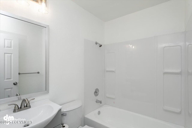 full bath featuring vanity, washtub / shower combination, and toilet