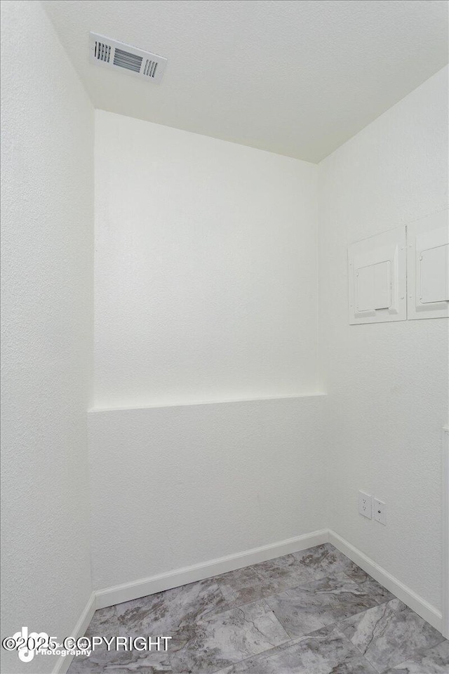 spare room with visible vents, carpet, and baseboards