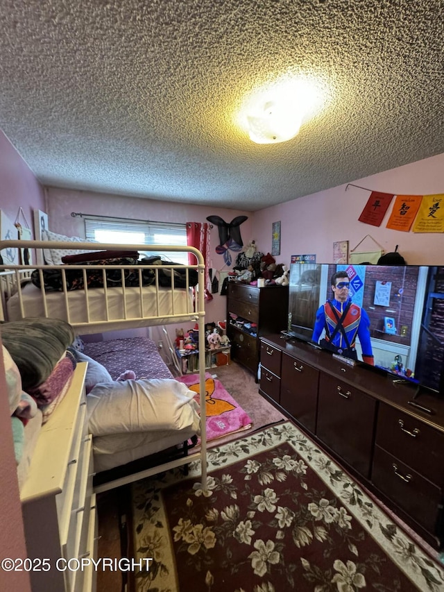 carpeted bedroom with a textured ceiling