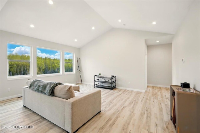 living room featuring light wood-type flooring, recessed lighting, and vaulted ceiling