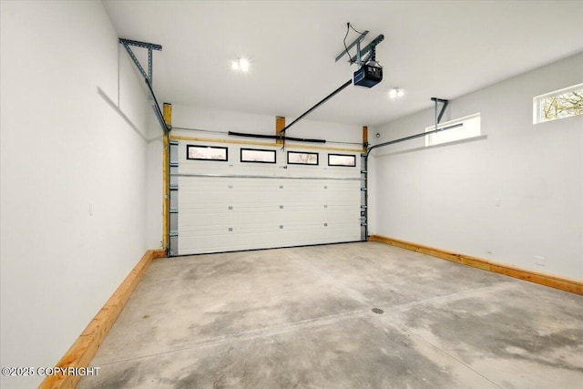 garage featuring baseboards and a garage door opener