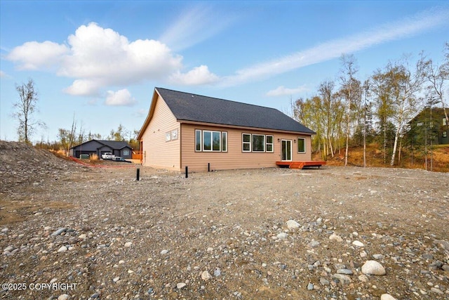 back of house featuring a deck