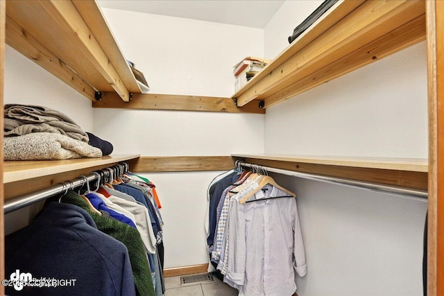 spacious closet with tile patterned flooring