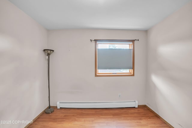 8515 Jewel Lake Rd # 25, Anchorage, AK 99502 - empty room with baseboard heating, wood finished floors, and baseboards