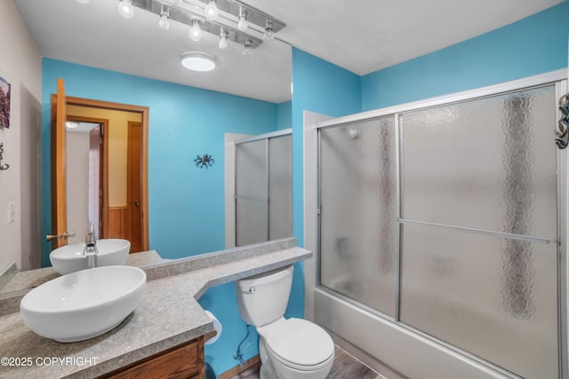 8515 Jewel Lake Rd # 25, Anchorage, AK 99502 - bathroom with vanity, toilet, and enclosed tub / shower combo