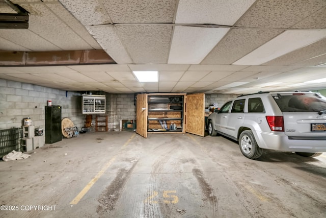 8515 Jewel Lake Rd # 25, Anchorage, AK 99502 - parking garage featuring concrete block wall