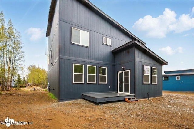rear view of property with a wooden deck
