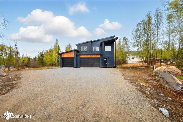 view of front of property with driveway and a garage