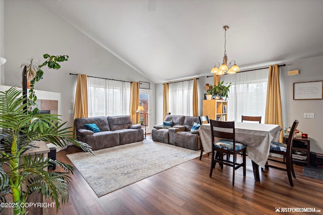 6801 E Tudor Rd, Anchorage, AK 99507 - living room with high vaulted ceiling, a chandelier, and wood finished floors