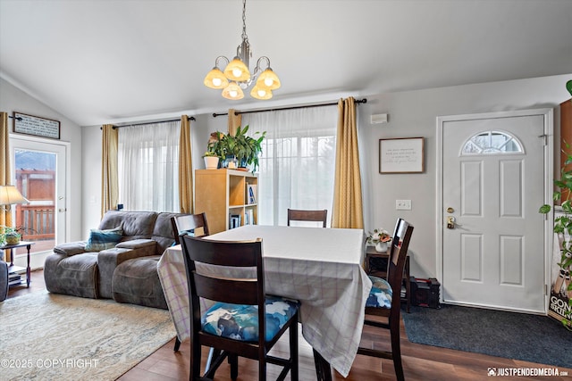 6801 E Tudor Rd, Anchorage, AK 99507 - dining space with an inviting chandelier, lofted ceiling, and wood finished floors