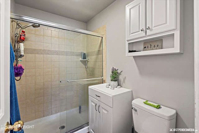 6801 E Tudor Rd, Anchorage, AK 99507 - full bath with toilet, a sink, and a stall shower