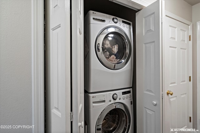 6801 E Tudor Rd, Anchorage, AK 99507 - laundry room with laundry area and stacked washer / drying machine