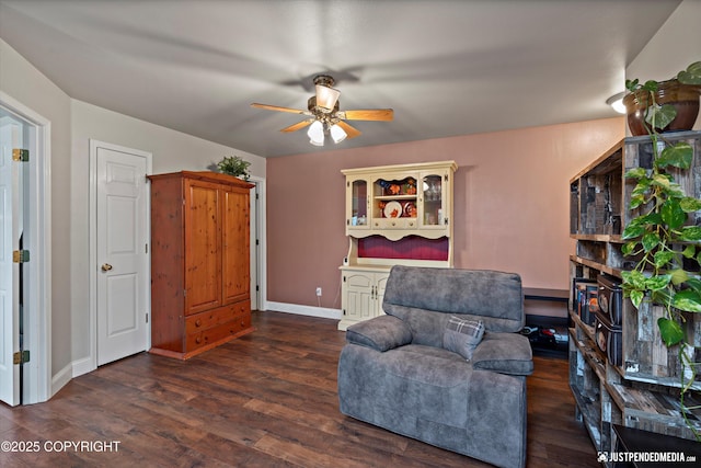 6801 E Tudor Rd, Anchorage, AK 99507 - living area with baseboards, a ceiling fan, and wood finished floors