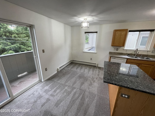 123 E 24th Ave # 4, Anchorage, AK 99503 - kitchen with carpet flooring, brown cabinets, a baseboard radiator, and white dishwasher