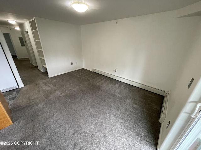 123 E 24th Ave # 4, Anchorage, AK 99503 - unfurnished room with dark carpet and a baseboard heating unit