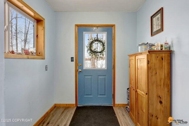 13706 E First St, Talkeetna, AK 99676 - foyer entrance with plenty of natural light and light wood-style flooring
