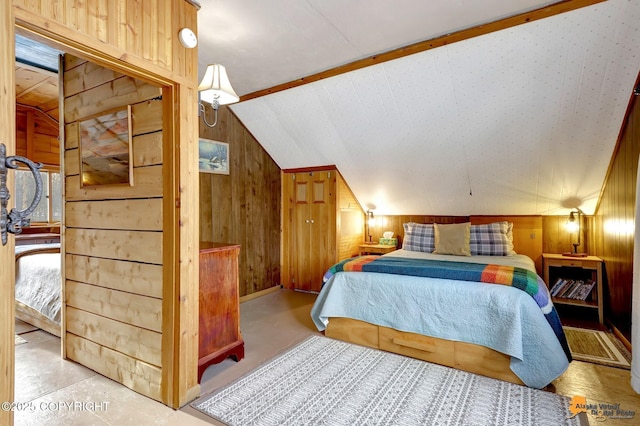 13706 E First St, Talkeetna, AK 99676 - bedroom featuring wooden walls, vaulted ceiling, and concrete flooring