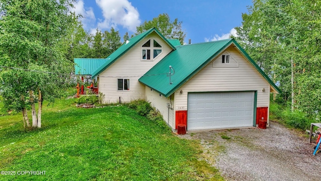 2643 S Rory Cir, Big Lake, AK 99654 - view of front facade with gravel driveway, metal roof, a front yard, and a garage
