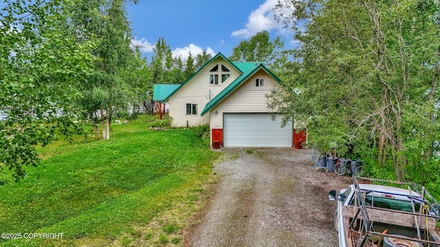 2643 S Rory Cir, Big Lake, AK 99654 - view of front facade featuring a garage and a front lawn