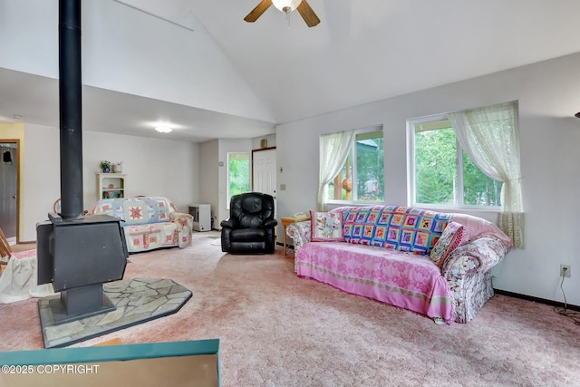 2643 S Rory Cir, Big Lake, AK 99654 - living area with a wood stove, carpet, a ceiling fan, and high vaulted ceiling